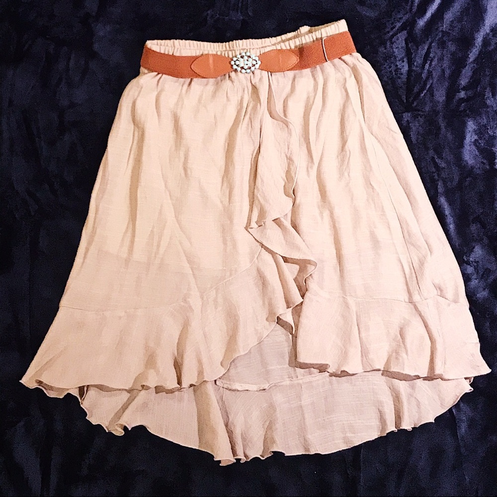 Midi length cream skirt with turquoise belt clasp